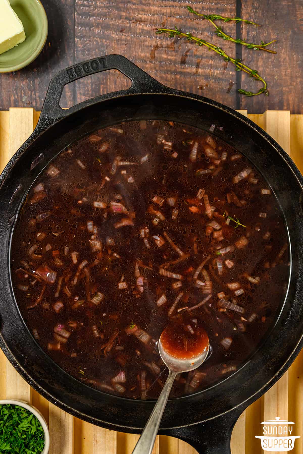 red wine sauce cooking in skillet