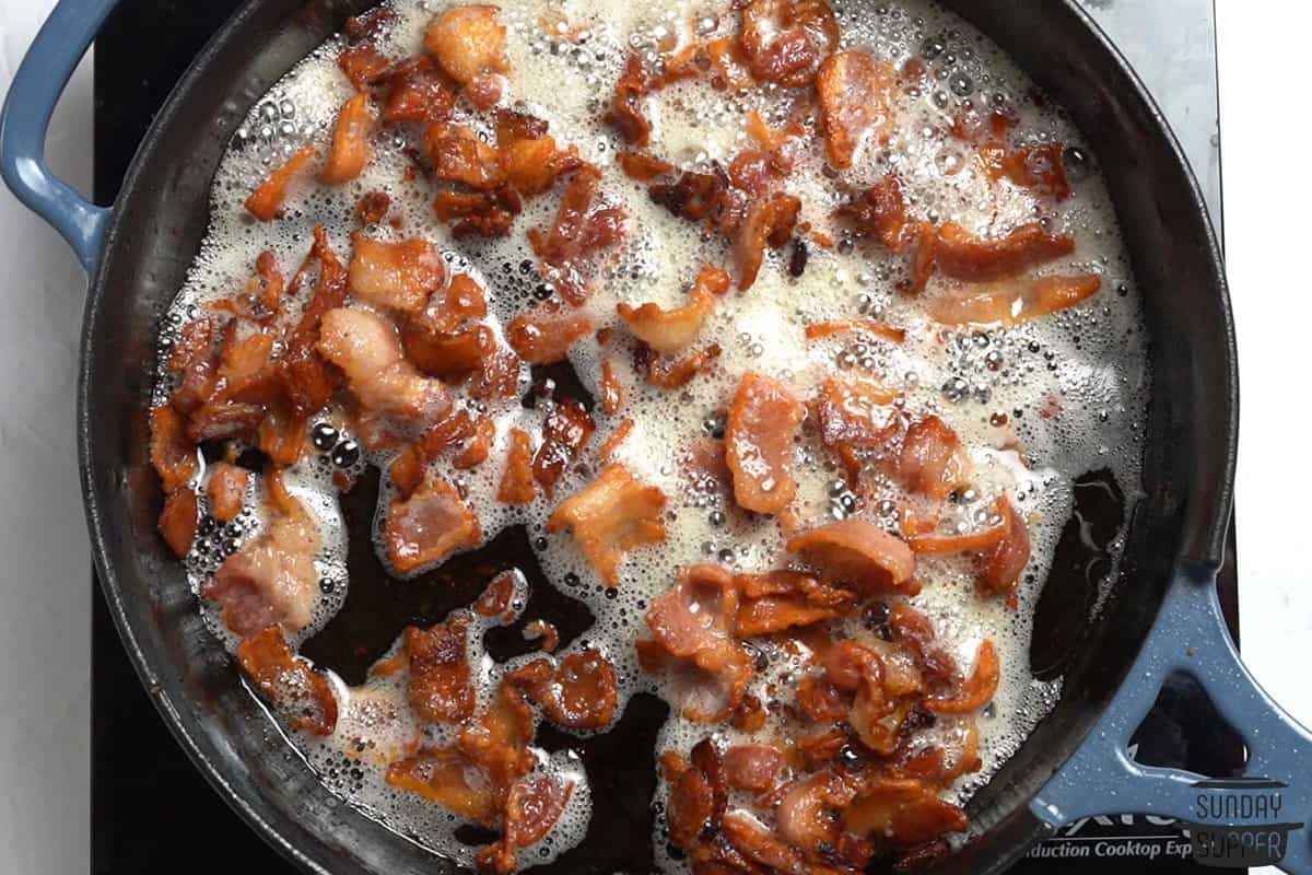 cooking bacon on the skillet
