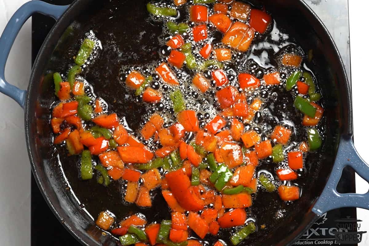 sautéing peppers in a skillet