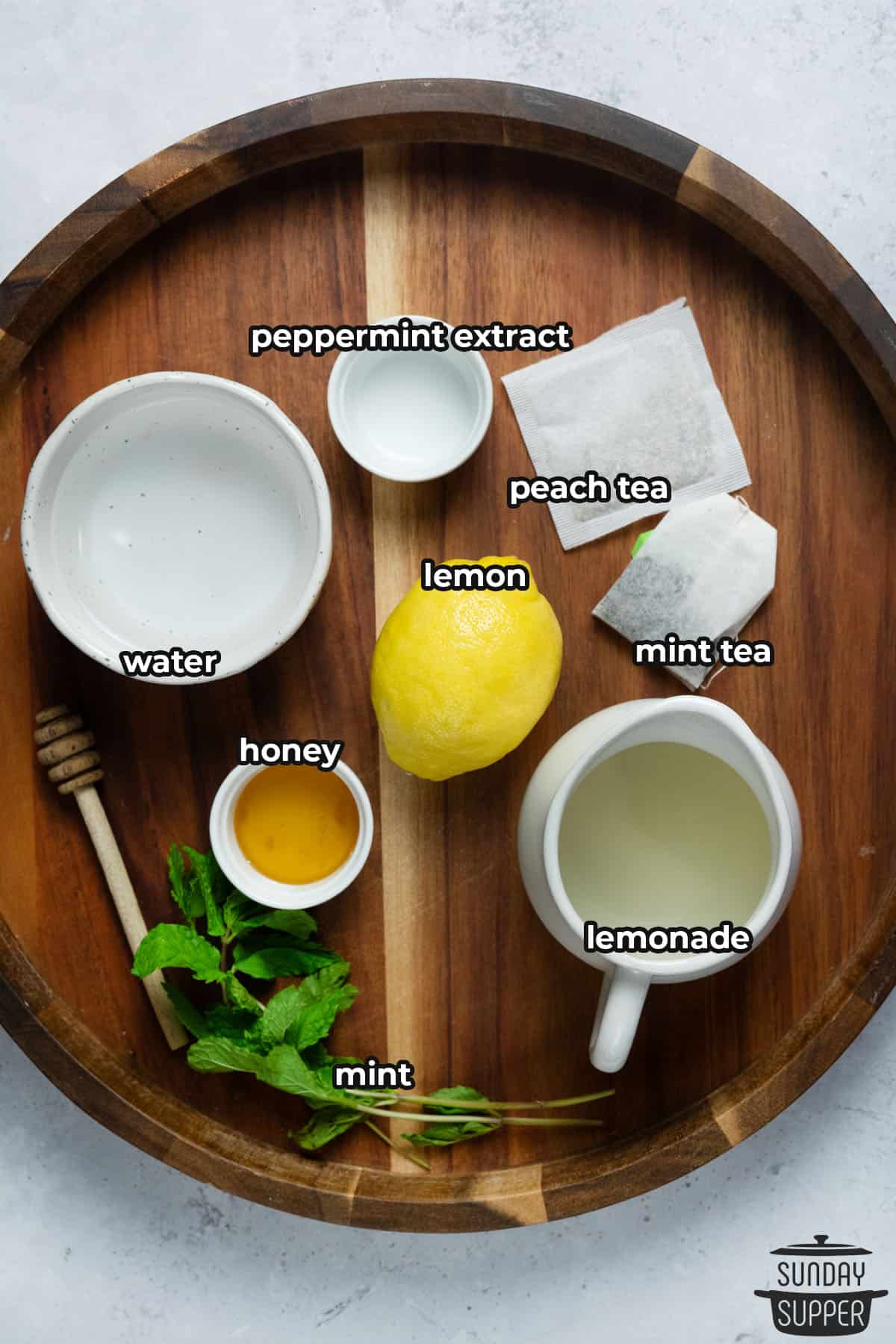 ingredients for starbucks medicine ball with labels on a wooden board