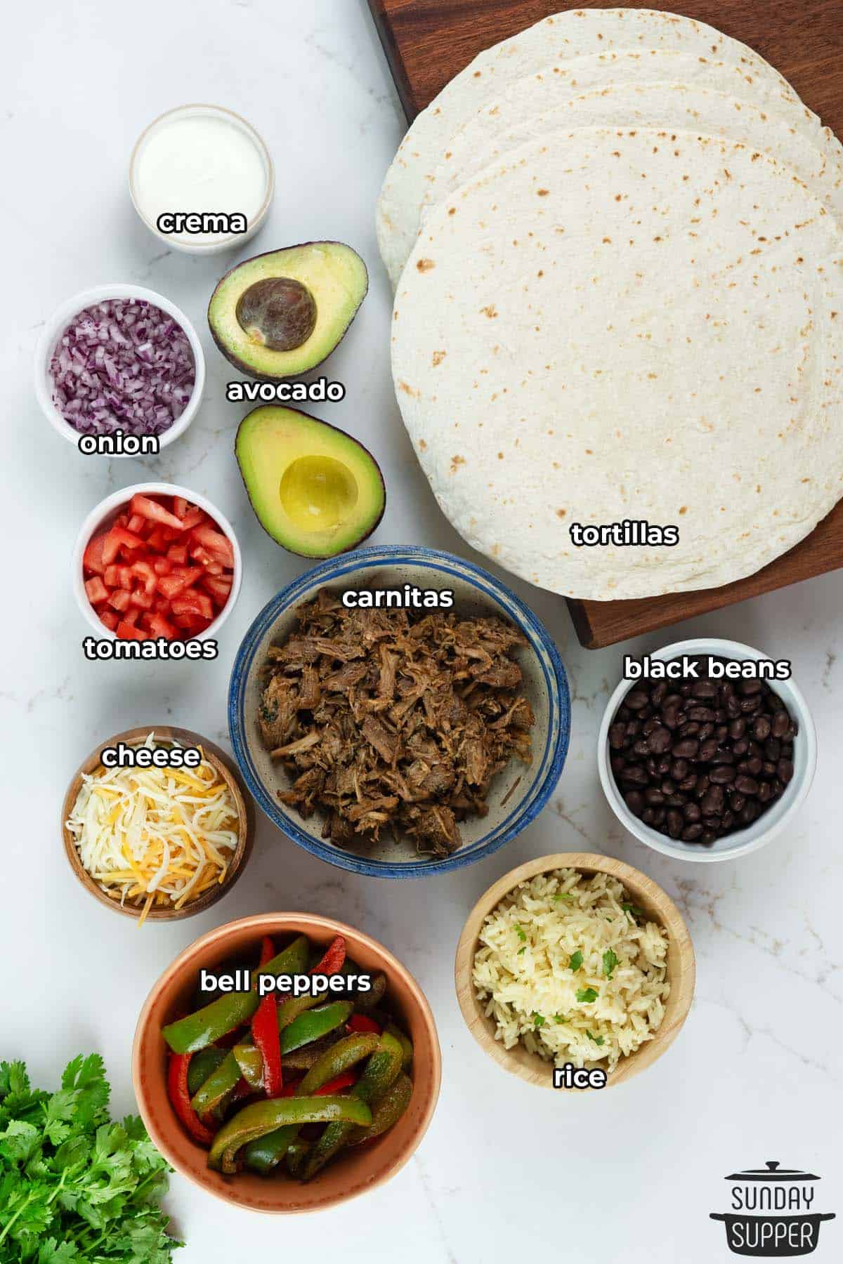 all the ingredients for carnitas burritos with labels