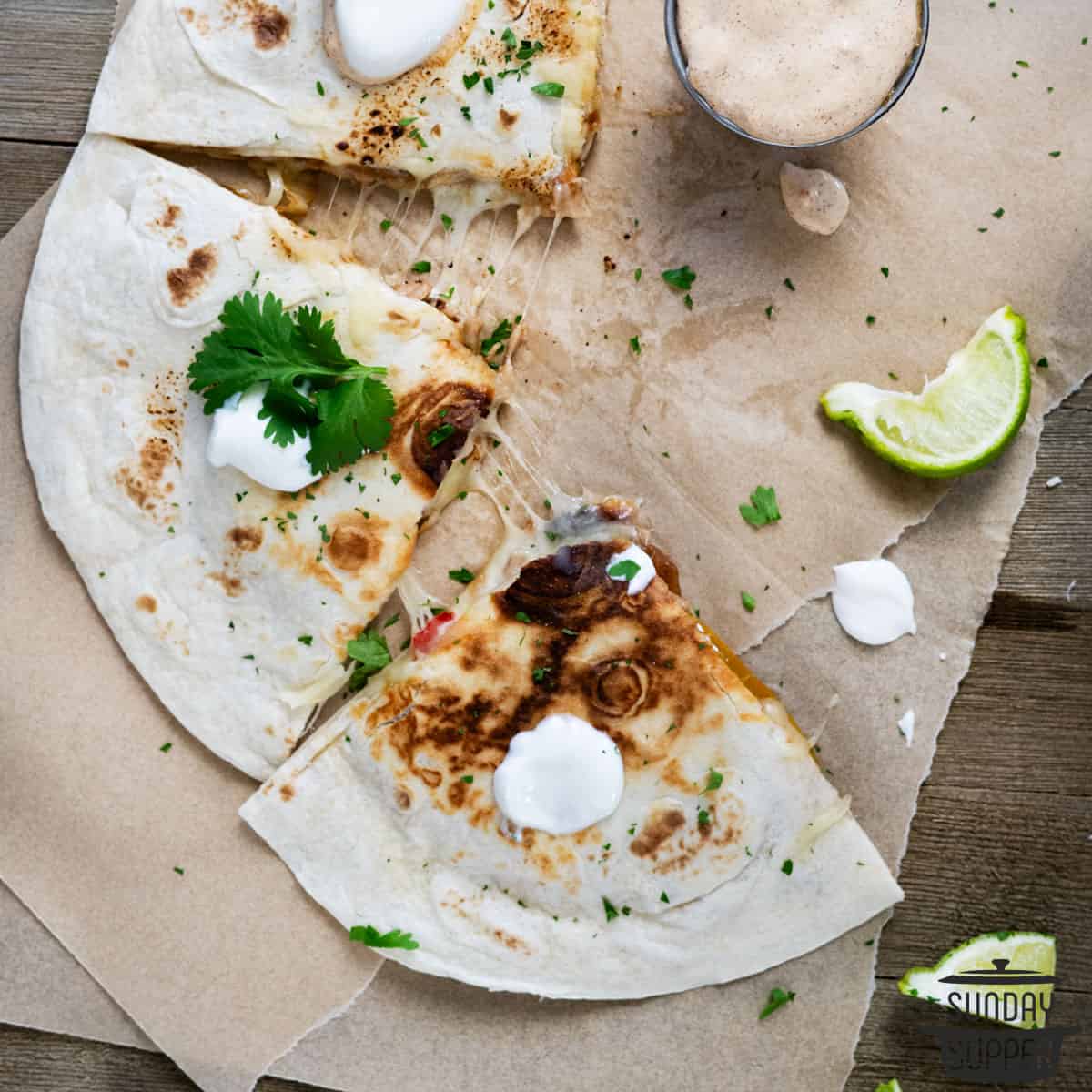 sliced pulled pork quesadillas with extra toppings