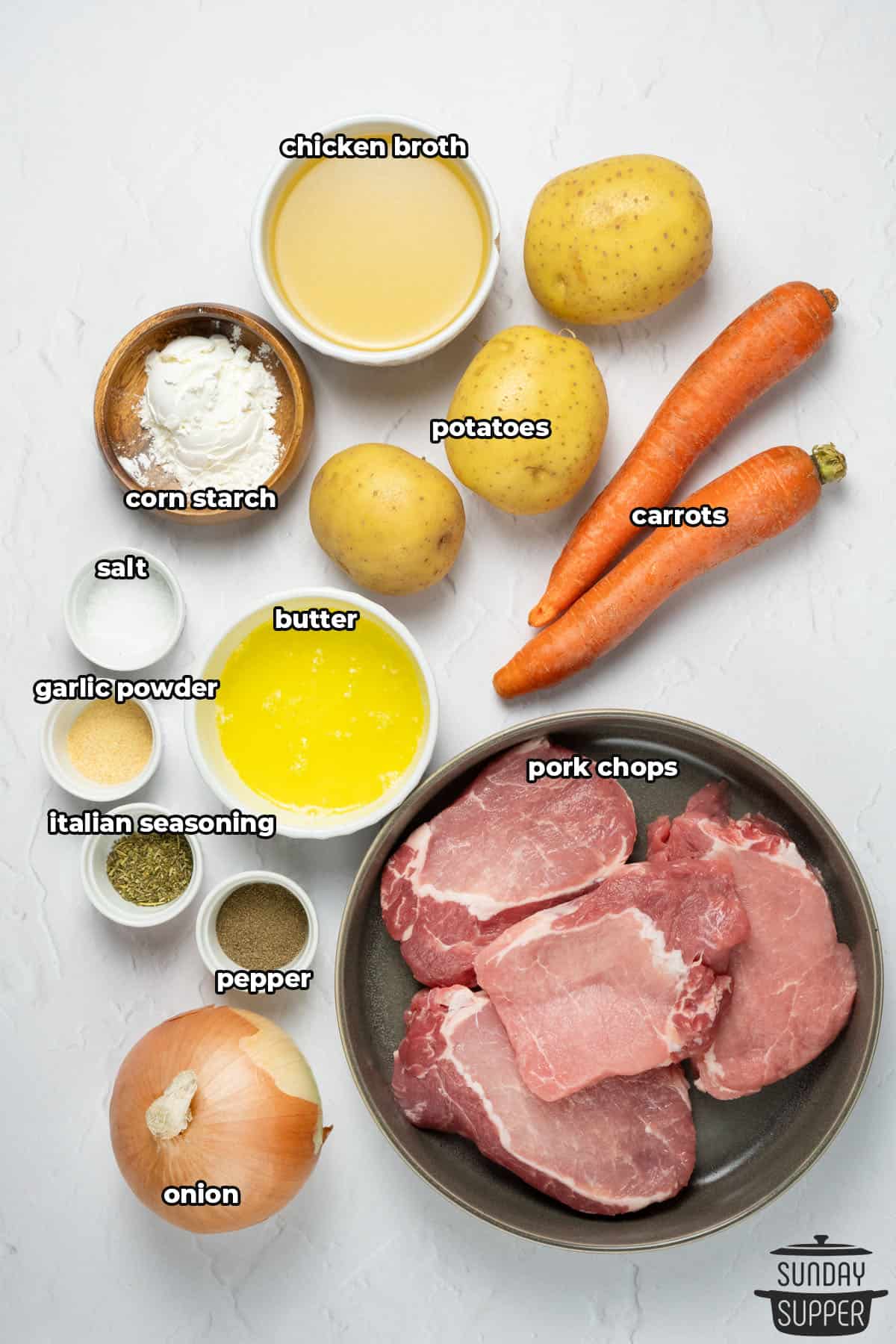 all the ingredients for slow cooker pork with potatoes and carrots