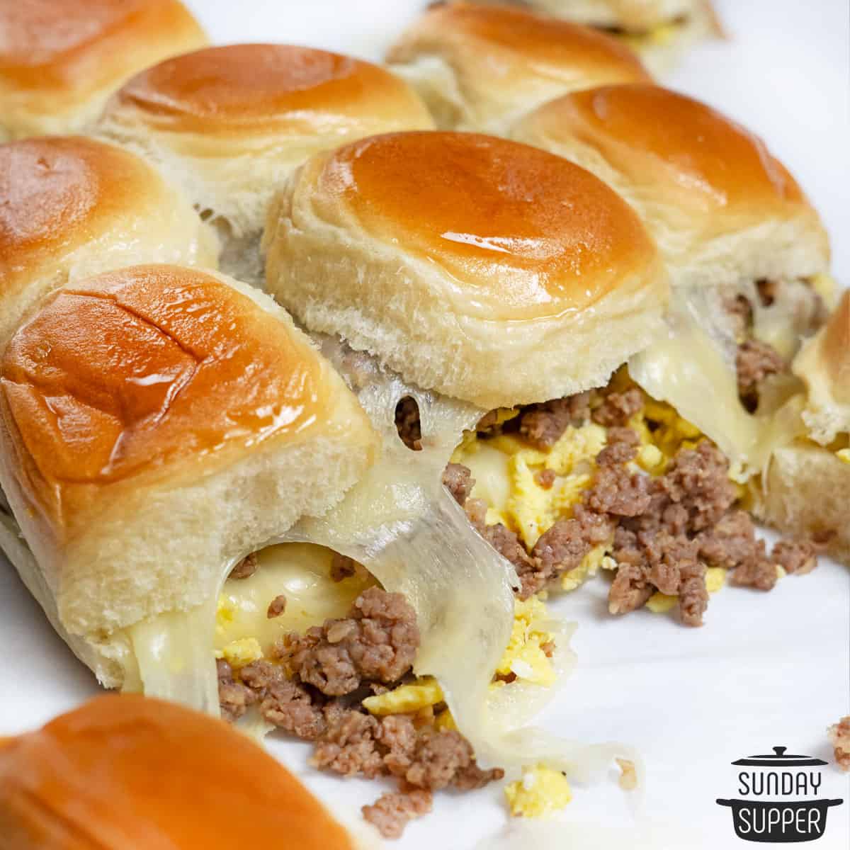 a row of cooked breakfast sliders