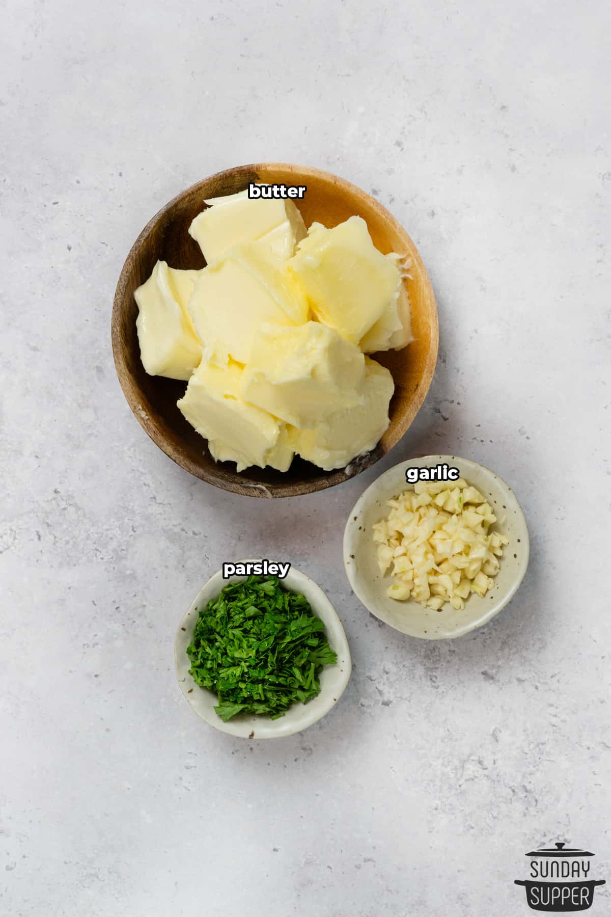 ingredients to make garlic butter with labels