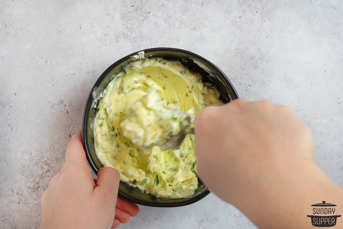 mixing garlic butter in a bowl