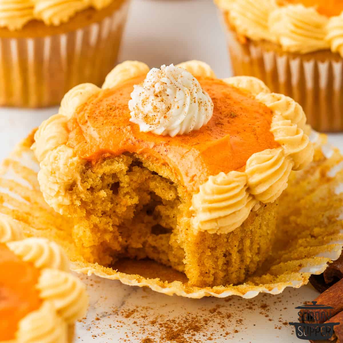 pumpkin cupcake with a bite taken out of it