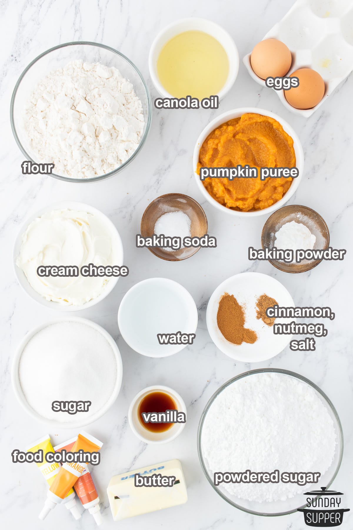 ingredients to make pumpkin spice cupcakes with labels