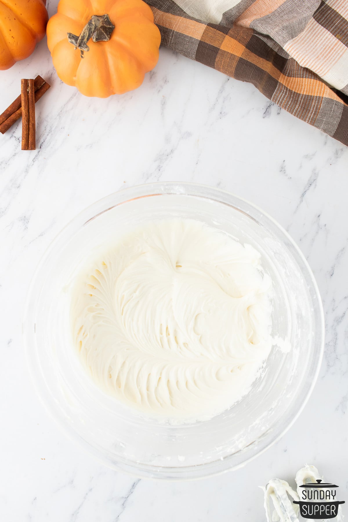 cream cheese frosting whipped in a bowl