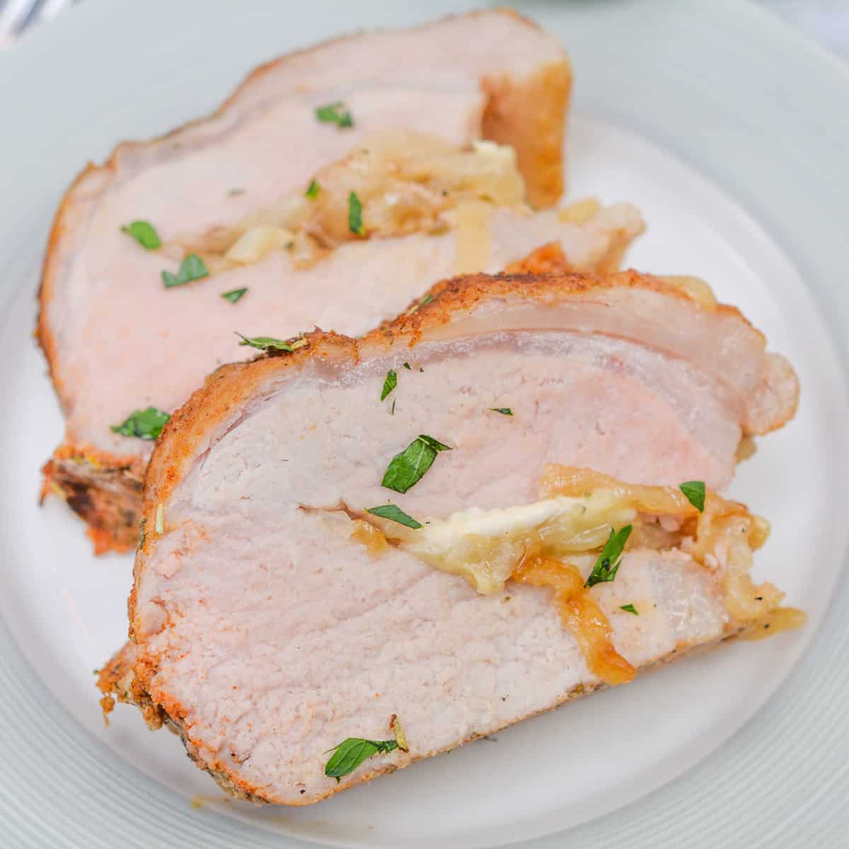 a closeup of two slices of stuffed pork tenderloin