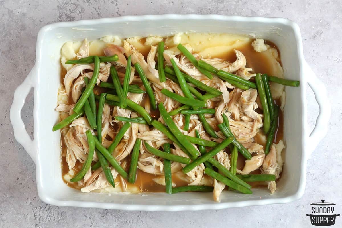 topping with green beans and gravy