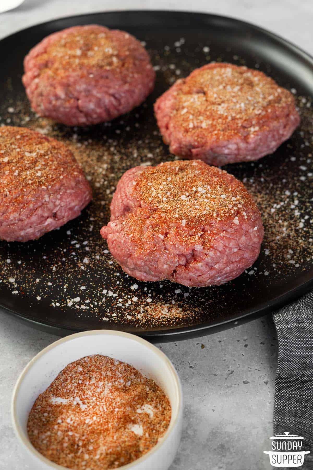 the seasoning added to four beef patties