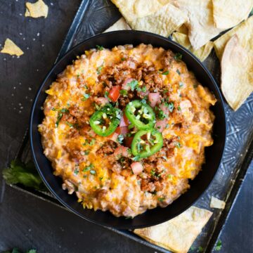 a closeup of a bowl of completed chorizo cream cheese dip