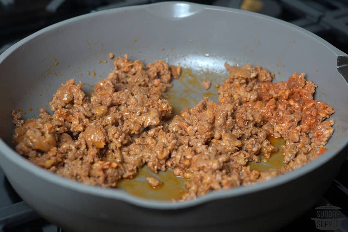 chorizo being browned in a pan