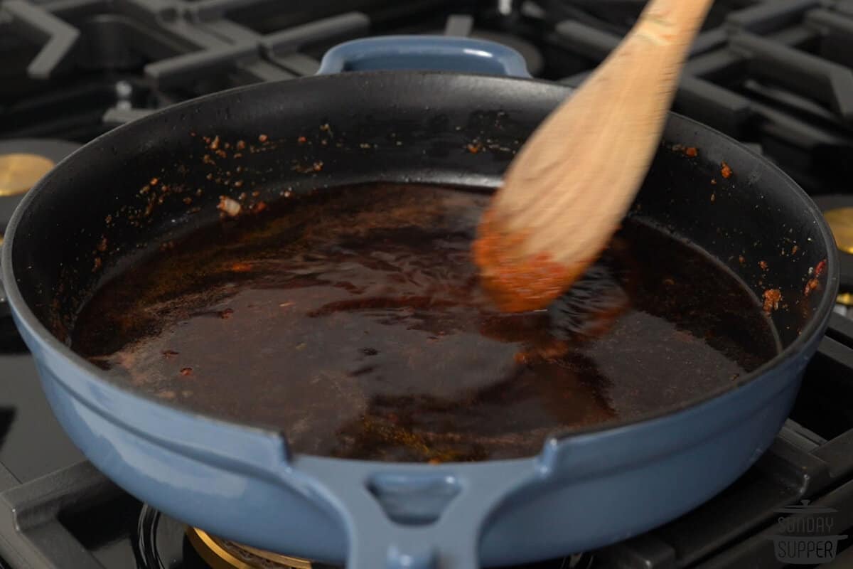 the wine reducing in the pan