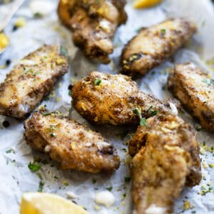 air fryer chicken wings up close on parchment paper