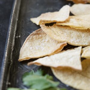 close up of tortilla chips on a platter