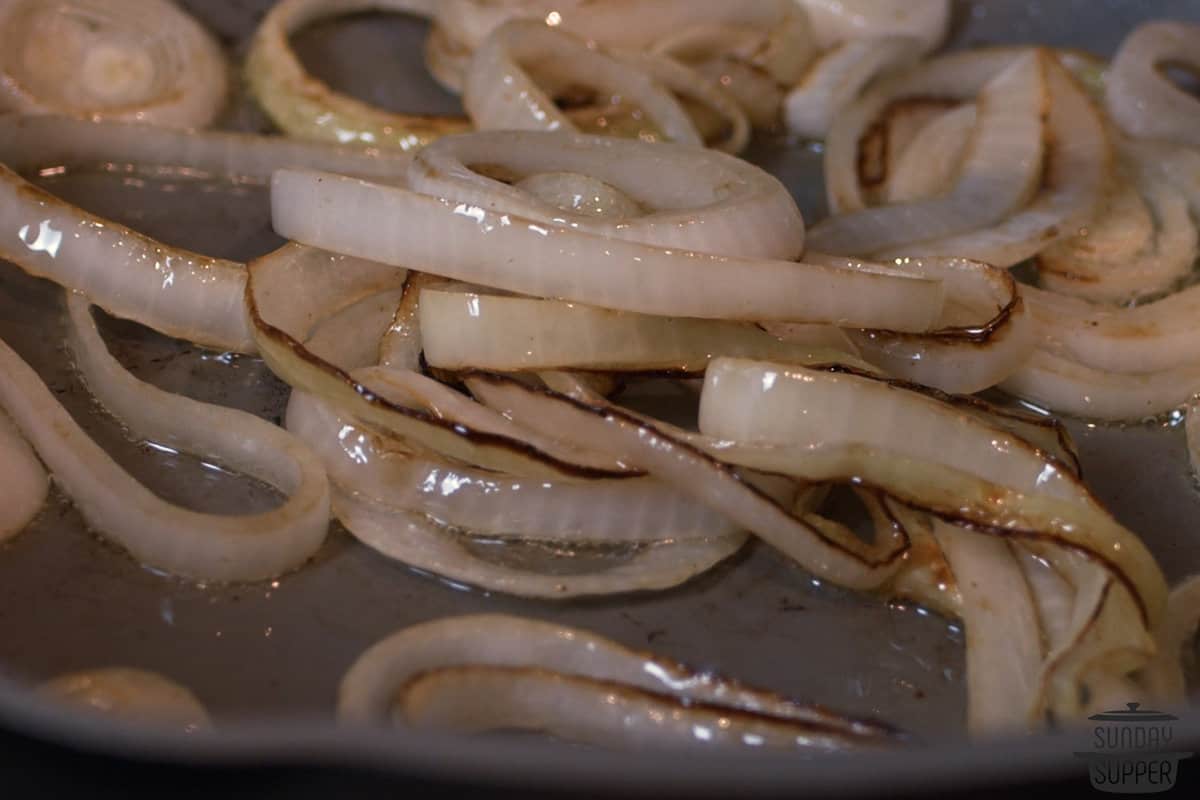 the onions browning in a pan
