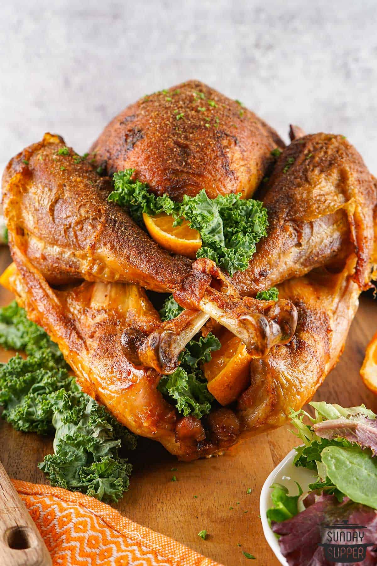 a roasted and fried cajun turkey with parsley and oranges
