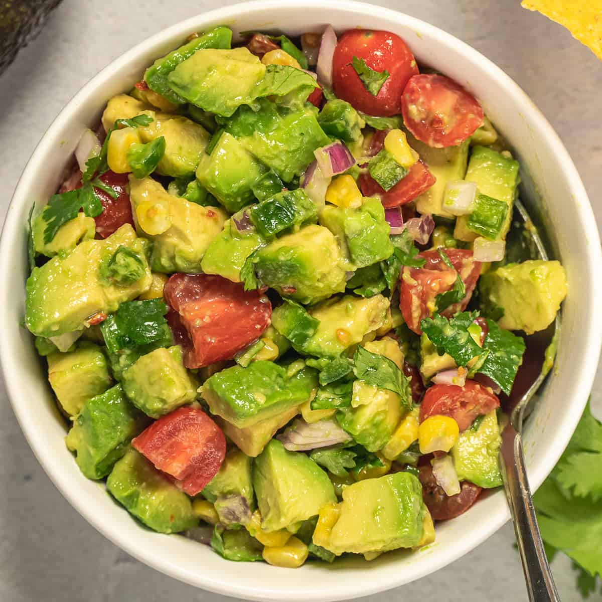 stirred up chunky guacamole in a bowl