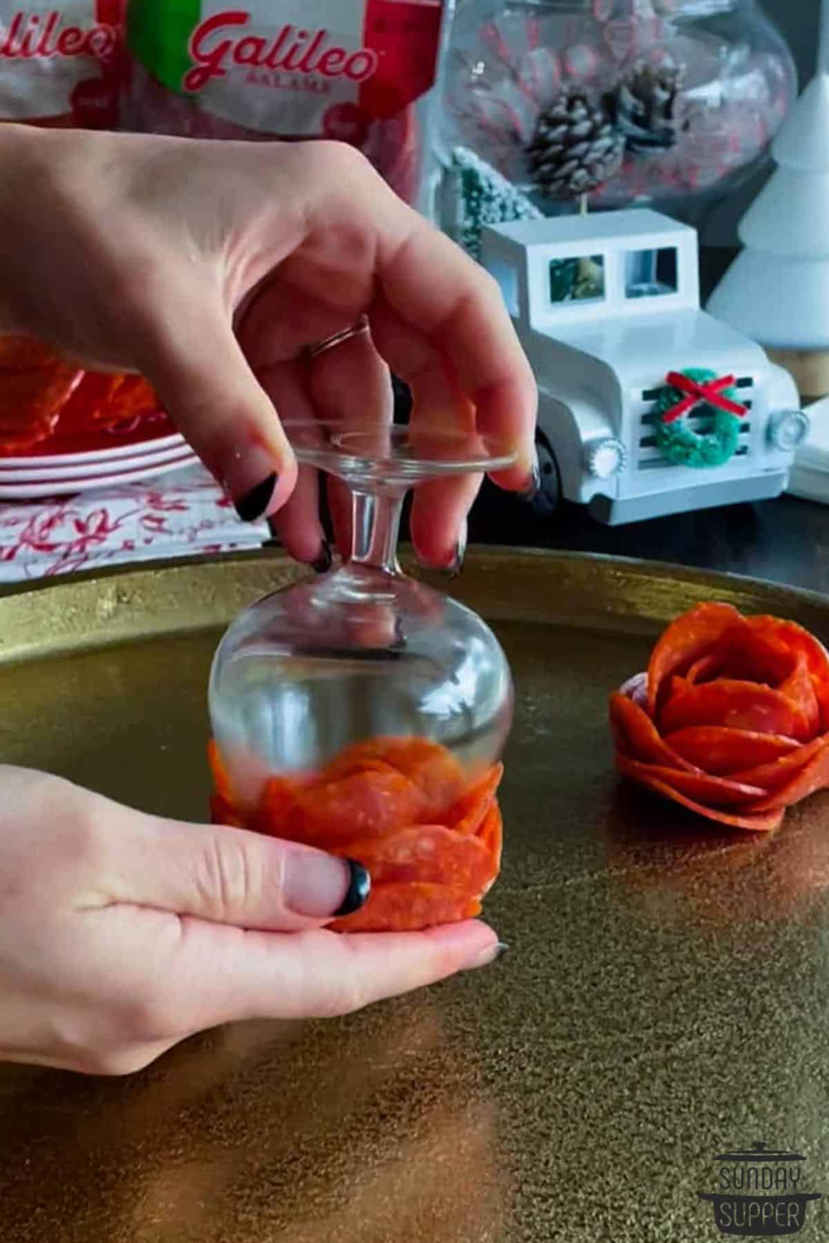 flipping the pepperoni flower after removing the paper towel