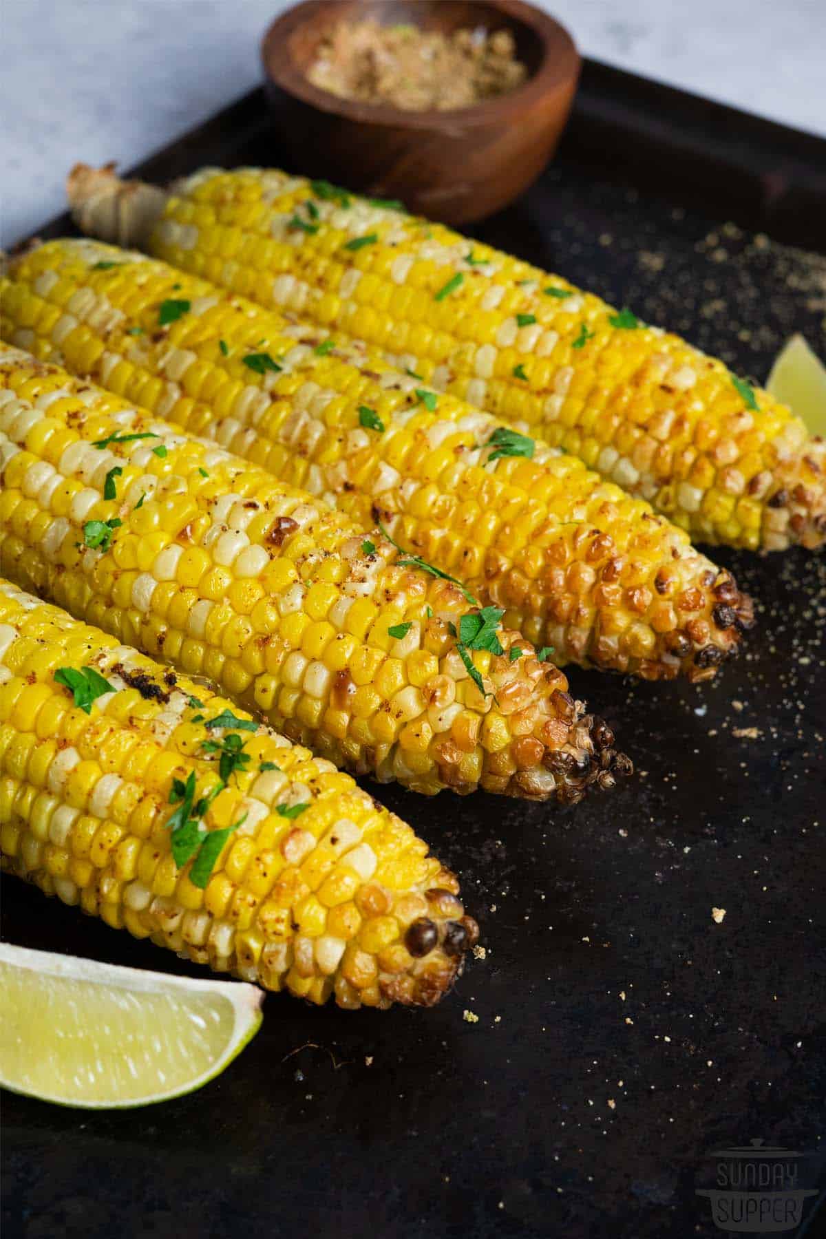a platter of four ears of air fried corn