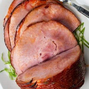 air fryer ham sliced on a white plate