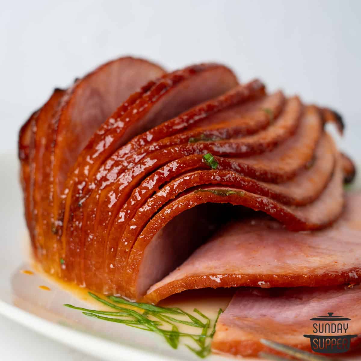 sliced air fryer ham on a plate