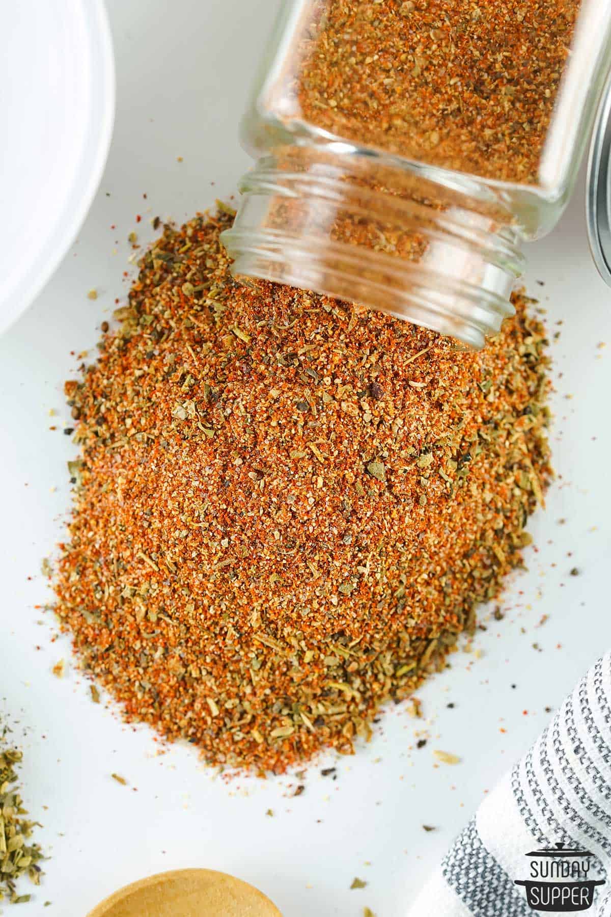 cajun seasoning spilling out of a spice jar