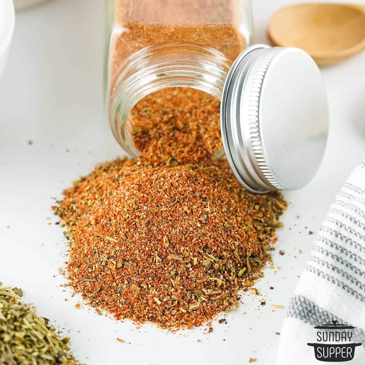 cajun spice spilling out of an open spice jar