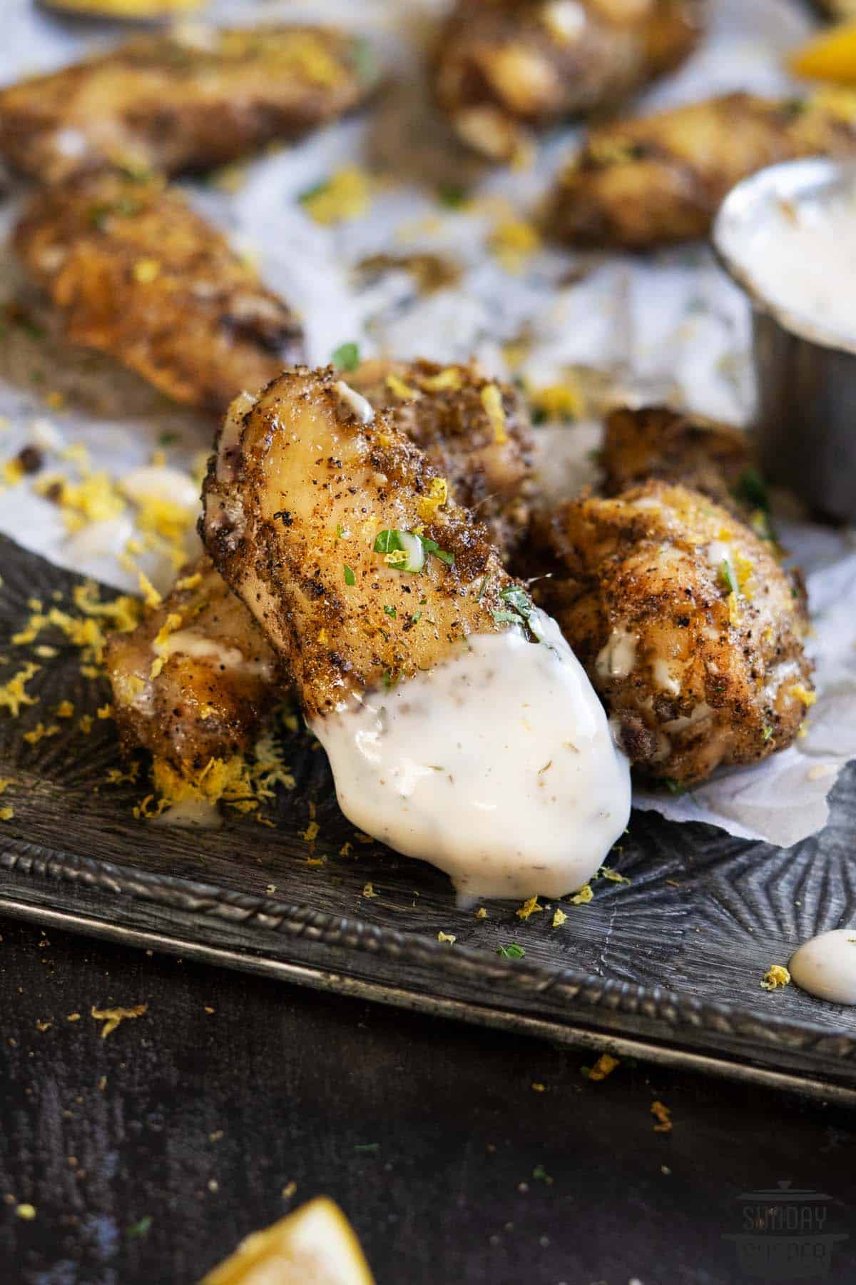 chicken wings dipped in chipotle ranch