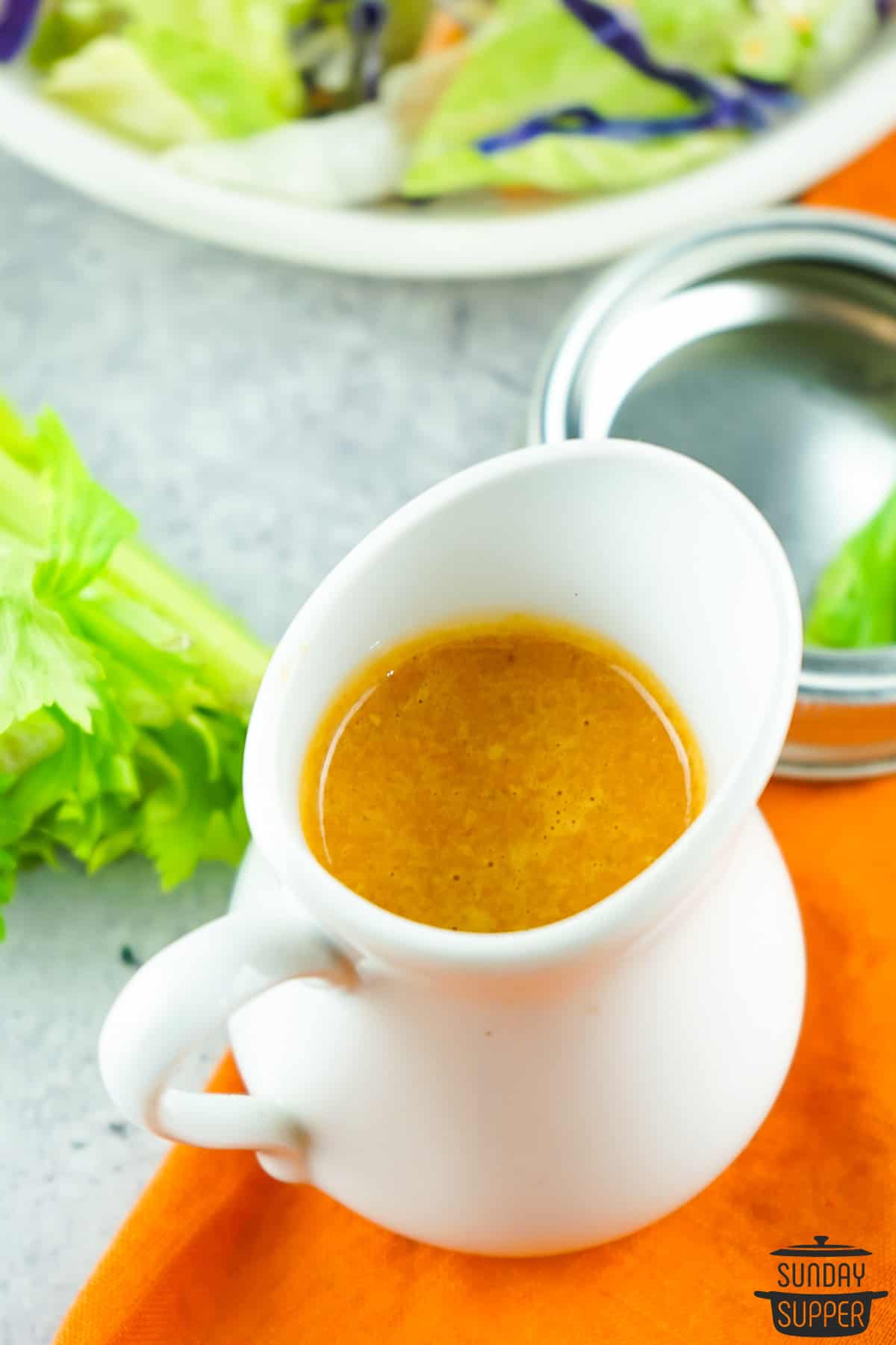 ginger dressing in a pouring cup