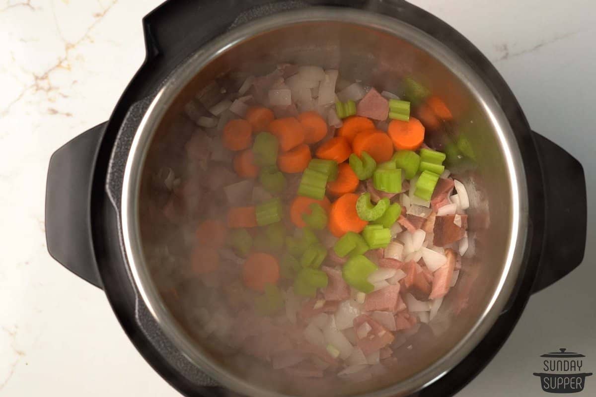 adding vegetables inside of the instant pot