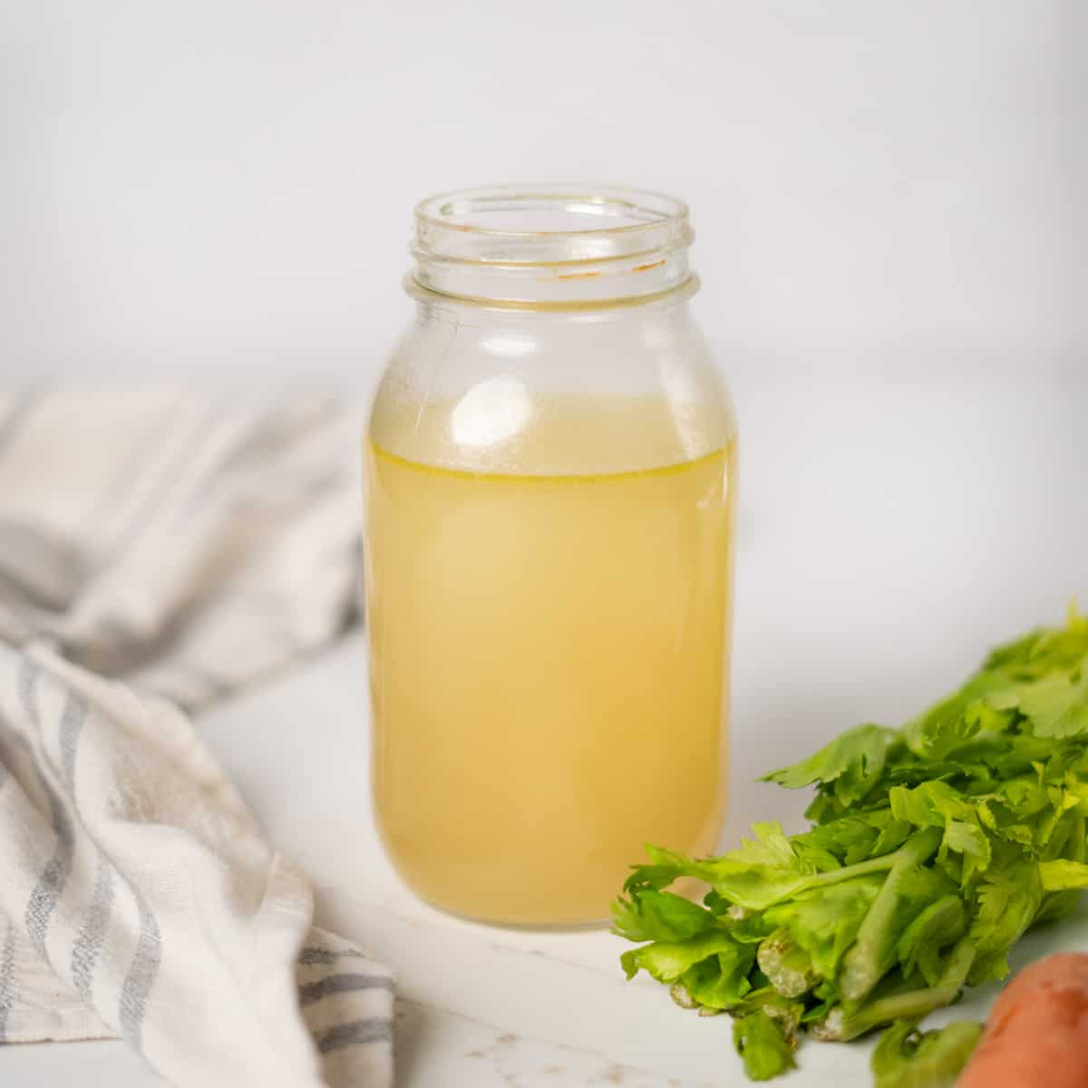 ham stock inside of a large mason jar