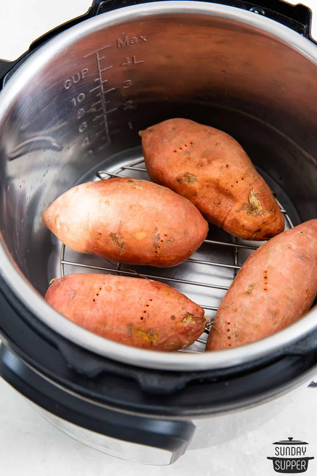 raw sweet potatoes placed in the instant pot