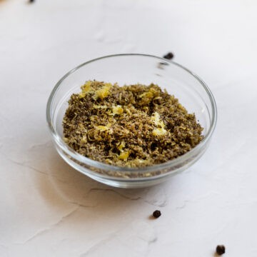 a glass bowl filled with lemon pepper seasoning