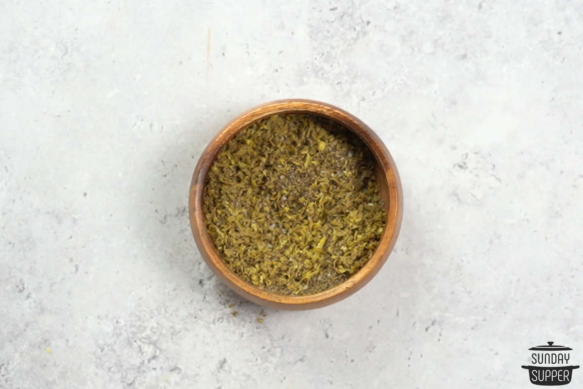 a small bowl filled with mixed lemon pepper seasoning