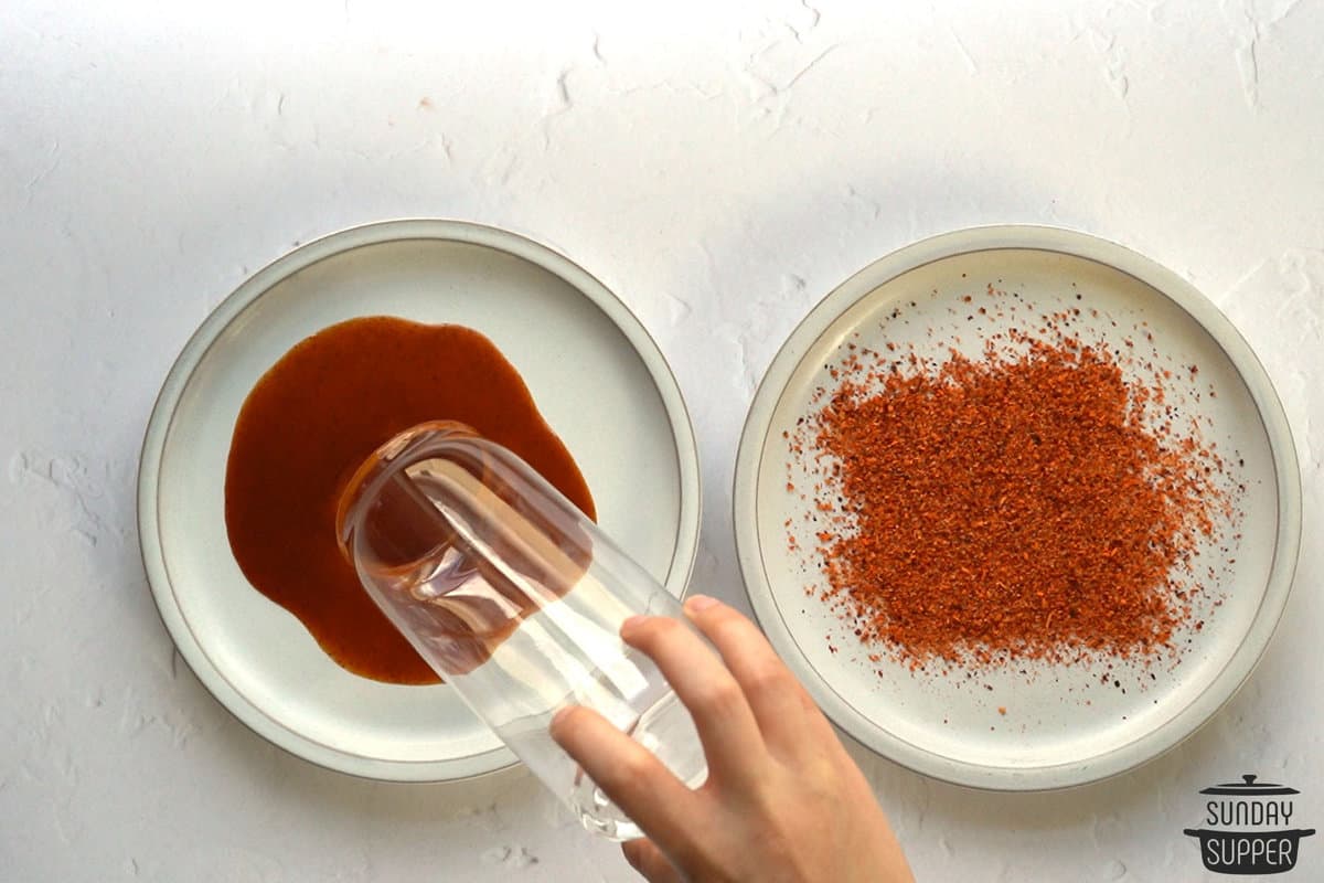 dipping glass into chamoy sauce