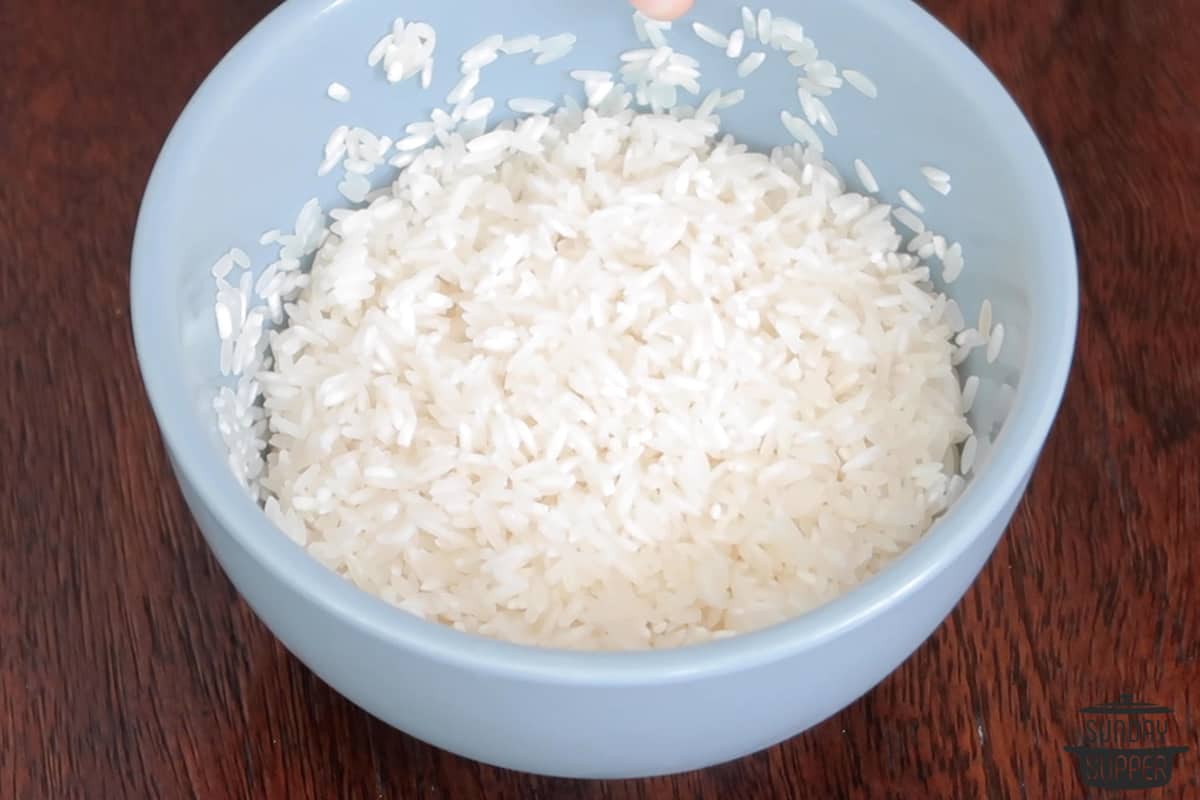 washing rice in a bowl