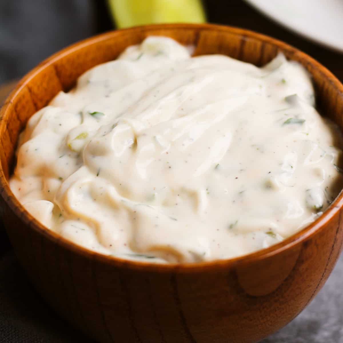 a wooden bowl of tartar sauce