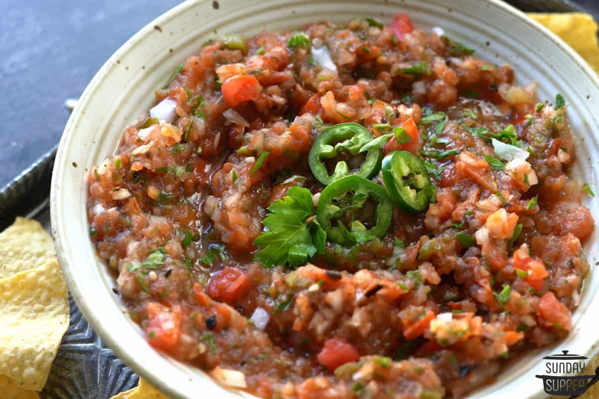 completed tomato salsa in a bowl with jalapeno