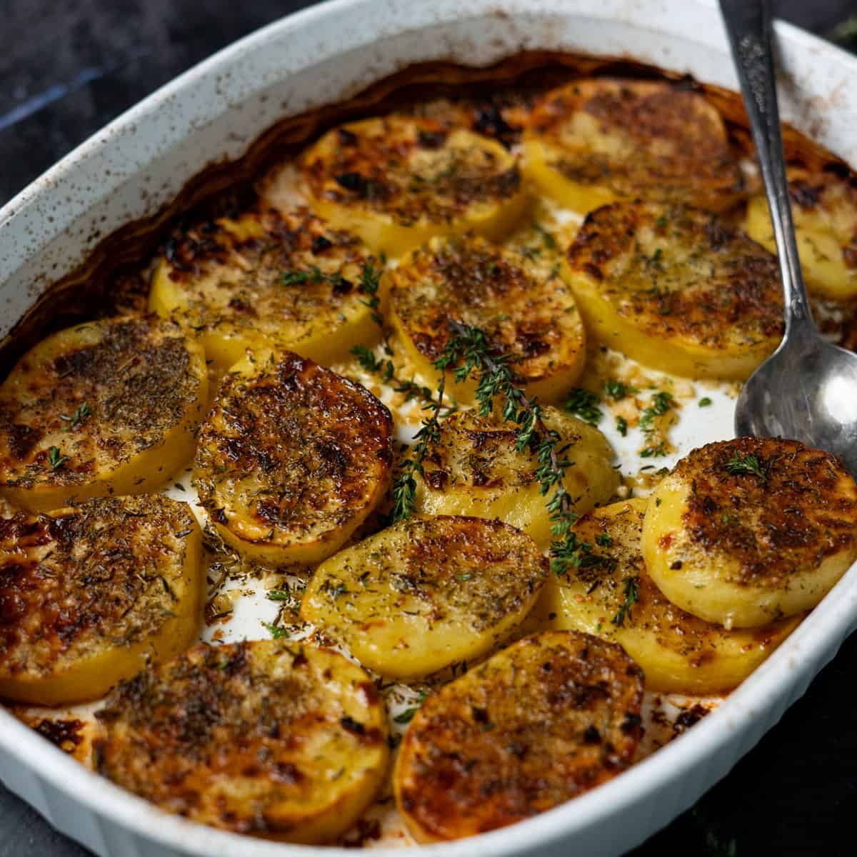 a closeup of crispy melting potatoes in a dish