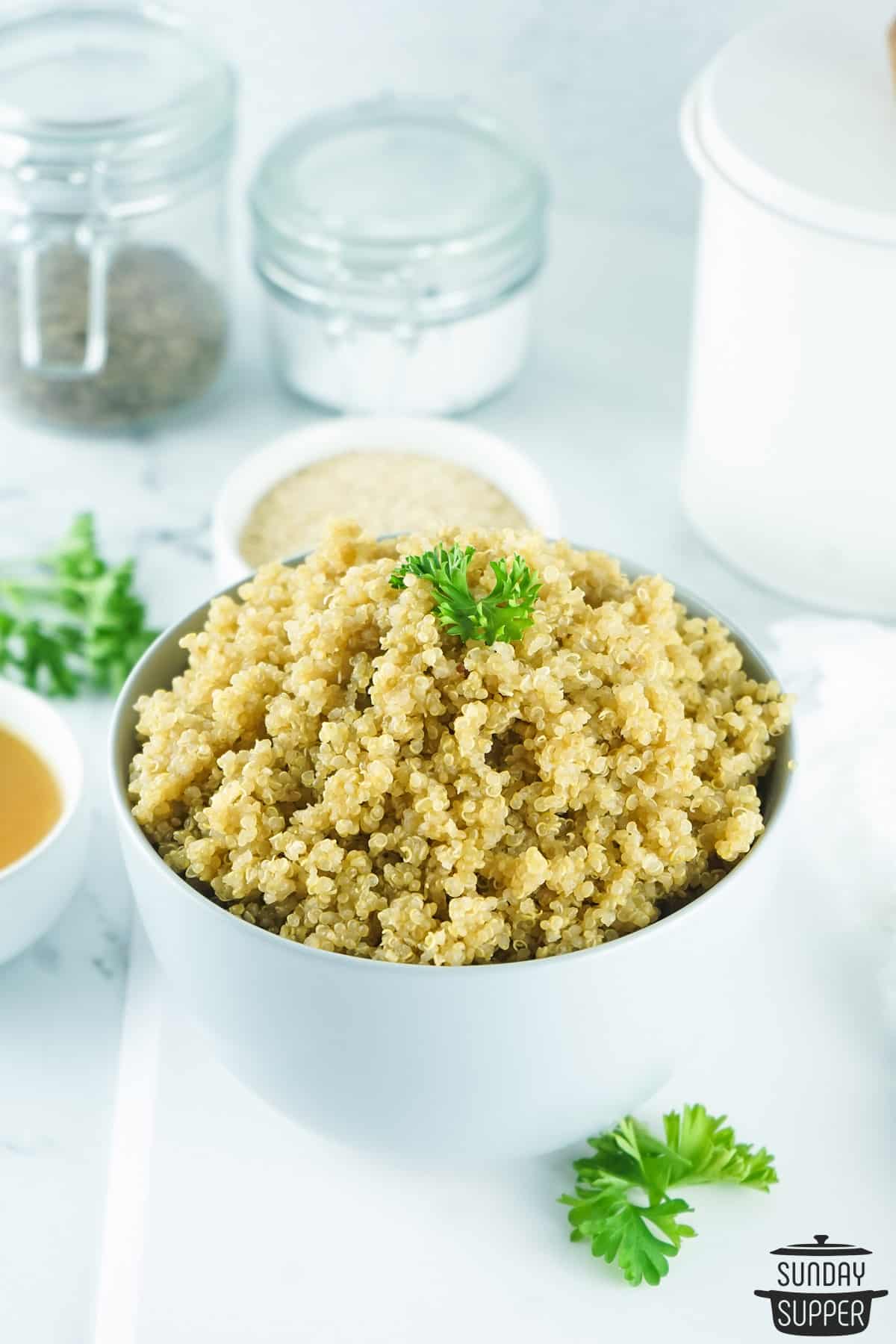 cooked quinoa in a bowl with salt and pepper