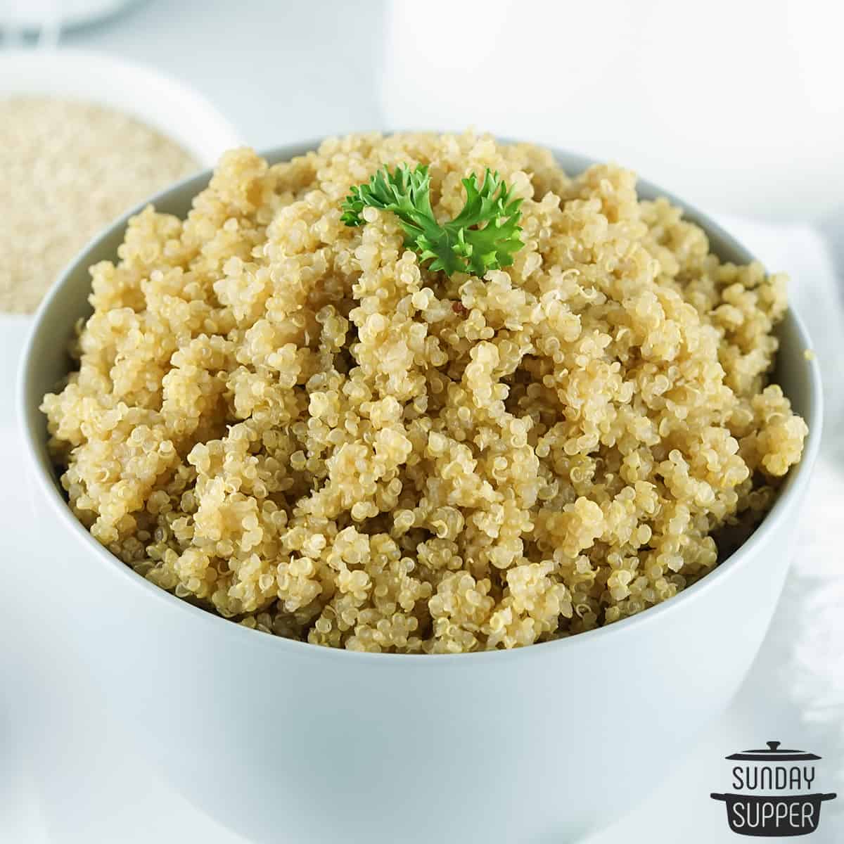 a white bowl filled with cooked quinoa