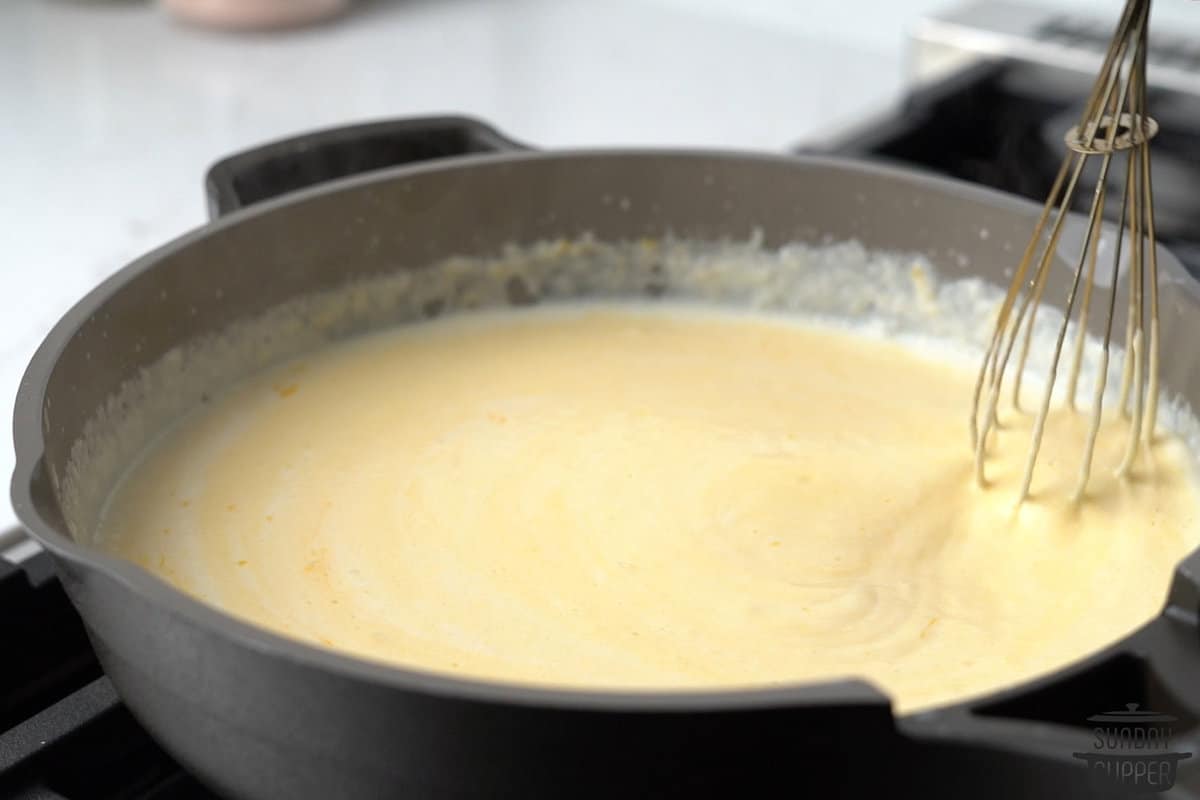 the cheese sauce fully combined in a pan