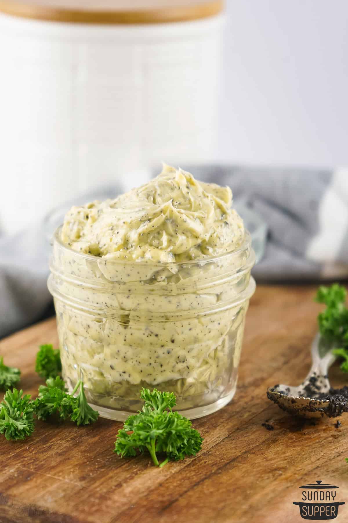truffle compound butter in a jar on a cutting board