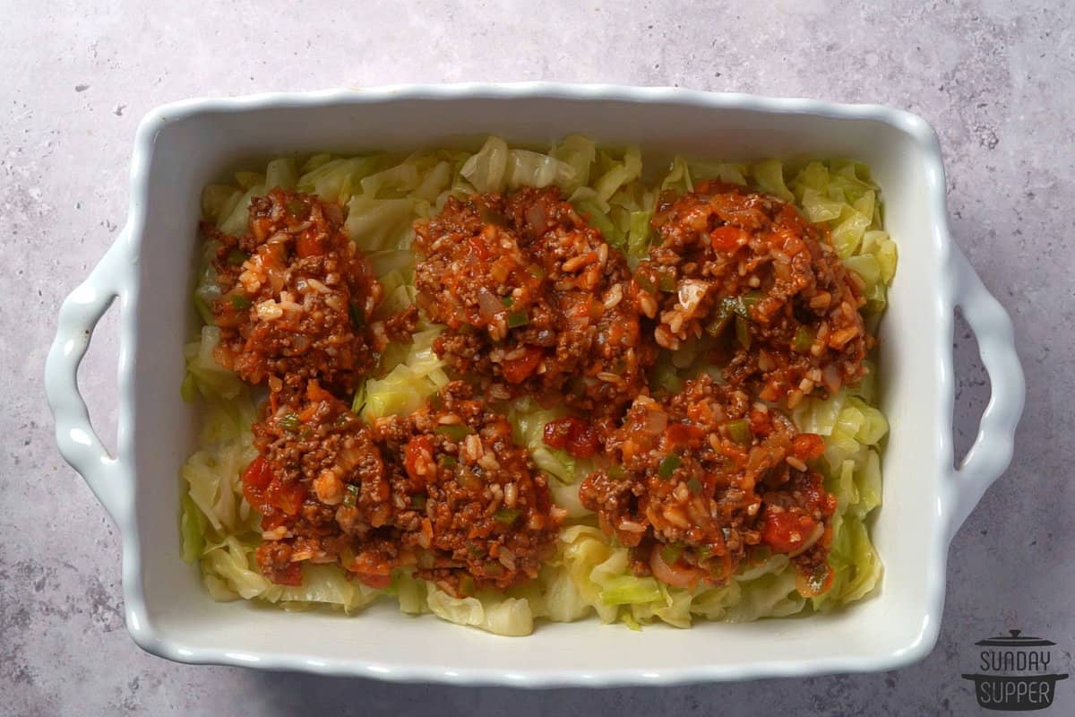 layer of ground beef mixture over the cabbage in a casserole dish