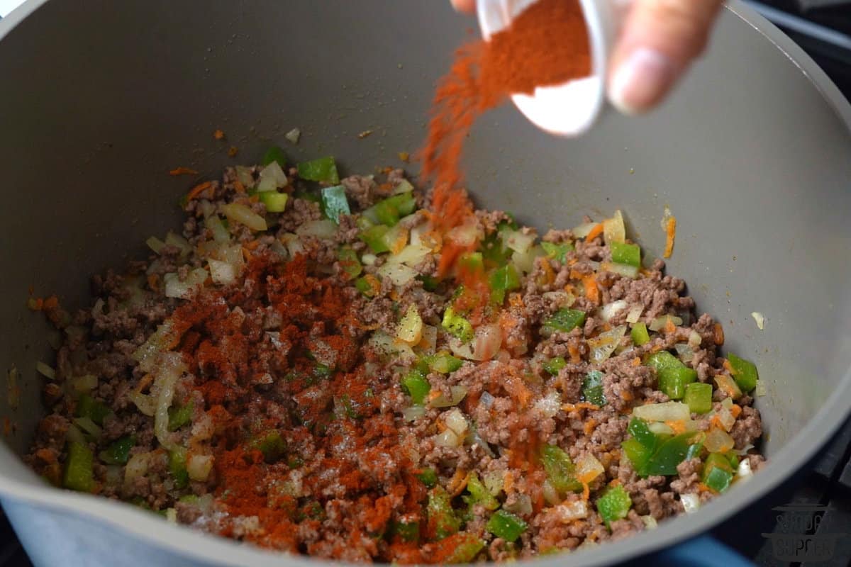 adding paprika to pot with ground beef mixture