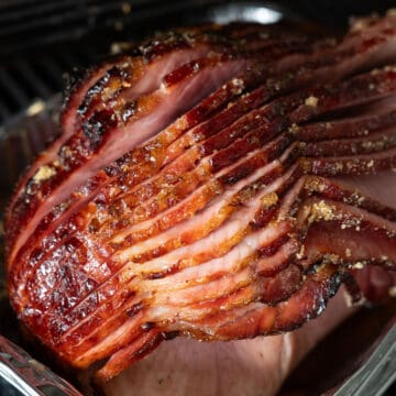 close up of grilled ham on a tray on the grill