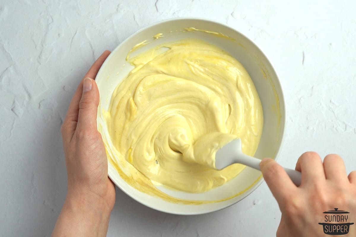 mixing mayo mustard sauce in a bowl